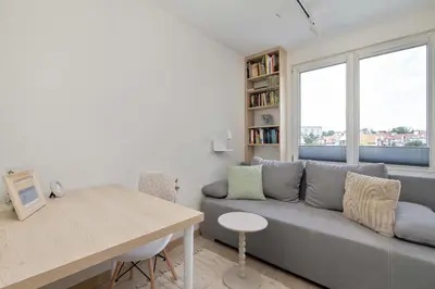 a living room with a couch and a table at Family Apartment with Air Conditioning with 3 Bedrooms in Cracow by Noclegi Renters in Kraków