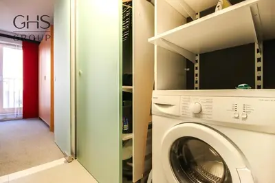 a laundry room with a washer and dryer at Ekskluzywny apartament, Browar Lubicz, FREE Parking in Kraków