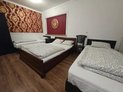 a bedroom with two beds and a window at Pod Różą in Rząska