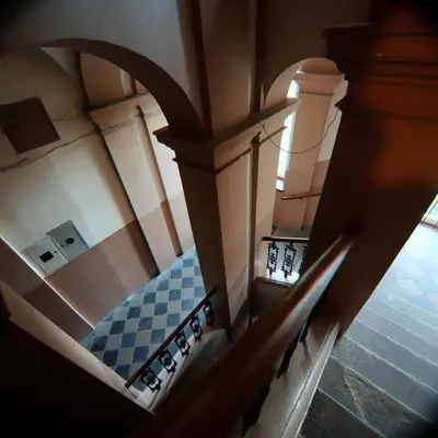 an overhead view of a staircase with blue and white tiles at Rose & Thyme Artisan Studio in Old Town in Kraków