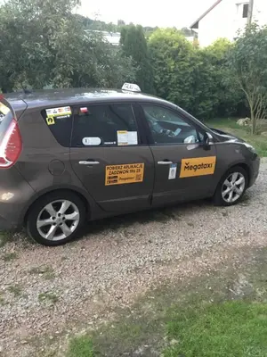 a car with a sign on the side of it at Pokoje Pod Lasem