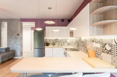 a large kitchen with a table and chairs in it at Niepołomice, kwatery, nocleg, pokoje,kwatery pracownicze in Niepołomice