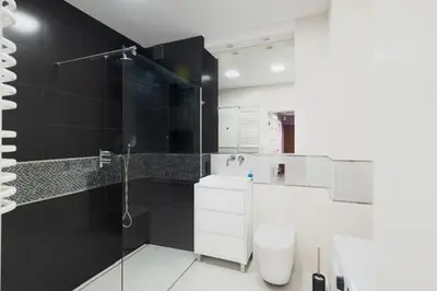 a bathroom with a shower and a toilet in it at Niepołomice, kwatery, nocleg, pokoje,kwatery pracownicze in Niepołomice