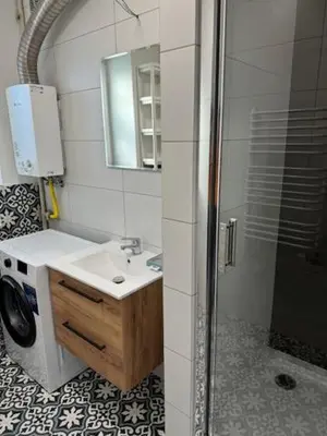 a bathroom with a sink and a washing machine at Niepołomice, nocleg,noclegi,dla firm,dom, pokoje in Niepołomice