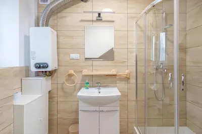 a bathroom with a shower and a sink at Niepołomice, nocleg,noclegi,dla firm,dom, pokoje in Niepołomice