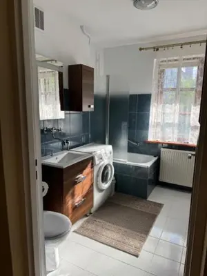 a bathroom with a toilet and a sink and a tub at Bochnia,kwatery pracownicze,duży dom, noclegi in Bochnia