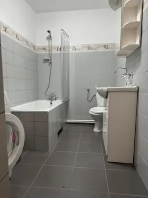a bathroom with a toilet and a tub and a sink at Bochnia,kwatery pracownicze,duży dom, noclegi in Bochnia
