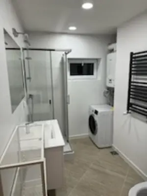 a bathroom with a shower and a sink and a toilet at Podłęże, Niepołomice, noclegi, kwatery pracownicze dla firm