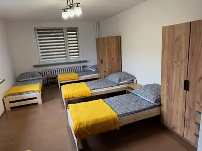 a room with four bunk beds in a room at Niepołomice,noclegi, pokoje, cały dom, kwatery pracownicze in Niepołomice
