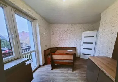 a room with a bed and a large window at Niepołomice,noclegi, pokoje, cały dom, kwatery pracownicze in Niepołomice