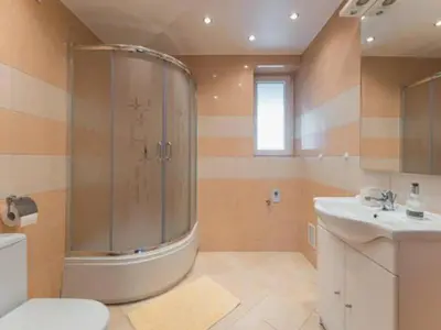a bathroom with a shower and a toilet and a sink at Nocleg Wadowice 2 in Wadowice