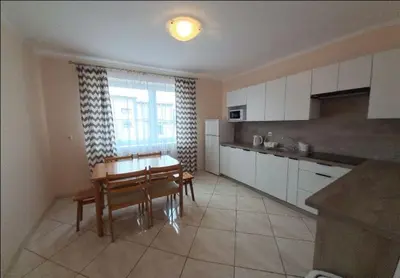 a kitchen with a table and a dining room at Nocleg Wadowice 2 in Wadowice
