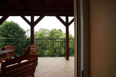 a view of a patio with chairs and a balcony at Nocleg Wadowice 2 in Wadowice