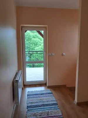 an empty room with an open door with a window at Nocleg Wadowice 2 in Wadowice