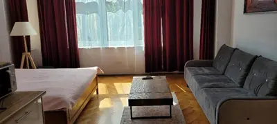 a living room with a couch and a coffee table at Asnyk Prestige Apartments in Kraków