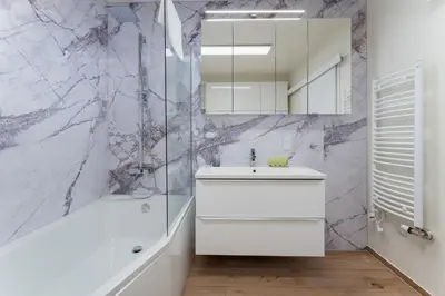 a bathroom with a white sink and a shower at Bohomolca Chic Studio with Garden by BookingHost in Kraków