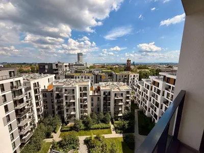 a view of a city with white apartment buildings at Modern Blue Apartment in Kraków