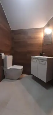 a bathroom with a toilet and a sink at Apartamenty Kraków-Bielany in Kraków