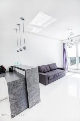 a living room with a couch and a table at Apartament Nadwiślańska in Kraków