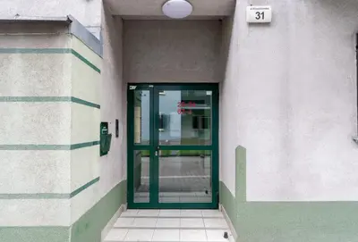 an entrance to a building with a green door at Kluczborska Chic Studio by BookingHost in Kraków