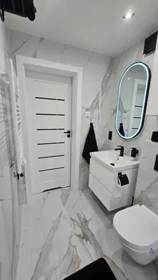 a bathroom with a sink and a toilet and a mirror at Leśna Enklawa pod Wielką Górą in Pisarzowa