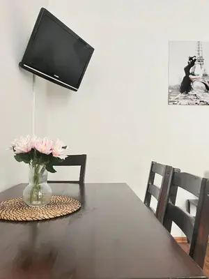 a kitchen with wooden cabinets and a sink at Smart Studio for 3 guests 8 min to Main Square in Kraków