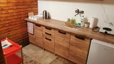 a kitchen with a sink and a wooden counter top at Chatka Cicho-Sza in Lanckorona