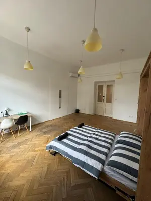a bedroom with a bed in the middle of a room at Fantastic-Inn Kraków - Krasińskiego in Kraków