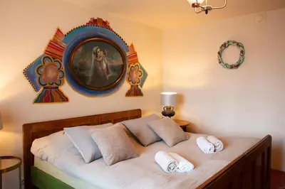 a bedroom with a bed with two pillows at Podgórska 7 in Lanckorona