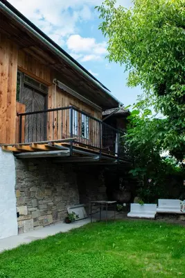 a house with a balcony on the side of it at Podgórska 7 in Lanckorona