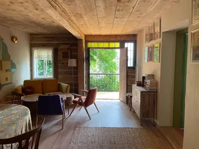 a living room with a couch and a table at Podgórska 7 in Lanckorona