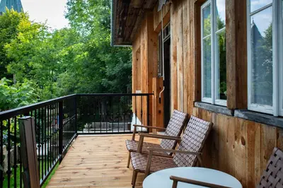 a porch with two chairs and a table at Podgórska 7 in Lanckorona