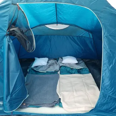 a blue tent with two beds in it at Uszate Ranczo Malinka in Rybna