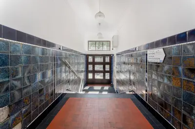 a hallway with tiles on the walls of a building at Krasińskiego Comfort Studio by BookingHost in Kraków
