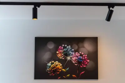 a painting of flowers hanging on a wall at Topolowa Modern Studio by BookingHost in Kraków