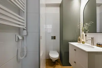 a bathroom with a toilet and a sink at UR4N Apartment - Konarskiego in Kraków