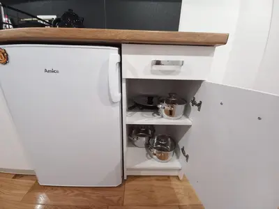 a kitchen with a white refrigerator and a counter at Old Town Apt - Lubicz 2b in Kraków