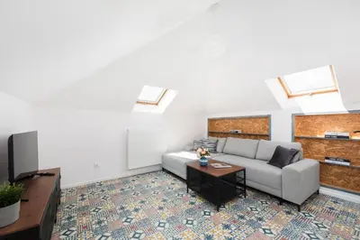 a living room with a couch and a table at Carlson near Enerdgylandia in Zator