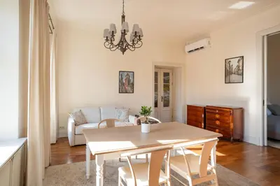 a living room with a table and a couch at Wolnica No 11 Residence in Kraków