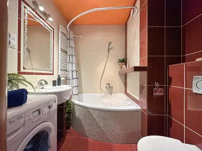 a bathroom with a sink and a washing machine at Krakowska Konstelacja Apartament premium in Kraków