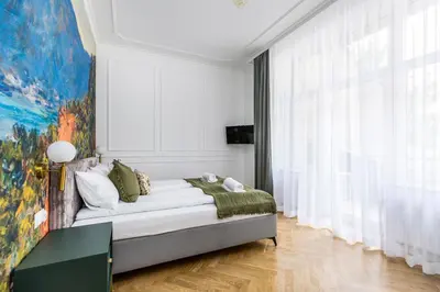 a living room with a couch and a large window at BoB Elite - Floriańska in Kraków