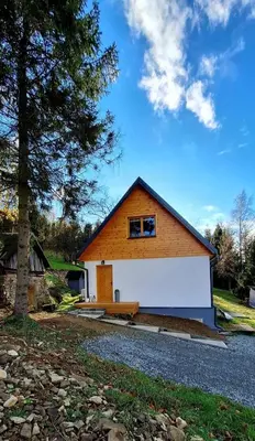 a house with a window on the side of it at Spokojnia Dom Wiejski in Zawoja
