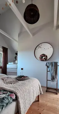 a bedroom with a bed and a ceiling at Spokojnia Dom Wiejski in Zawoja
