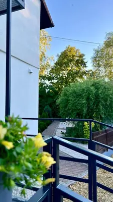 a view of a balcony with a plant at Aparthotel w Dolinie Stawów Zator in Zator