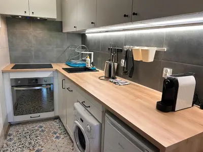 a kitchen with a sink and a counter top at Old Town Apt Kącik Street K10 in Kraków