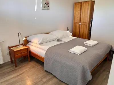 a bedroom with a bed with two towels on it at Old Town Apt Kącik Street K10 in Kraków