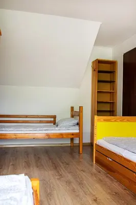 a room with two bunk beds and a shelf at Jurajska47 - trójka in Wola Kalinowska