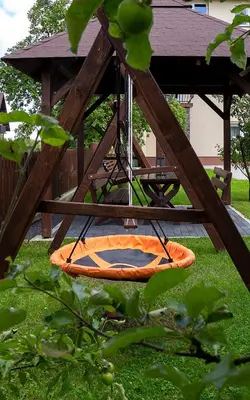 an orange kayak on a swing in a gazebo at Jurajska47 - trójka in Wola Kalinowska