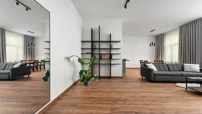 a living room with couches and a table at Old Town Deluxe Apartment by BookingHost in Kraków