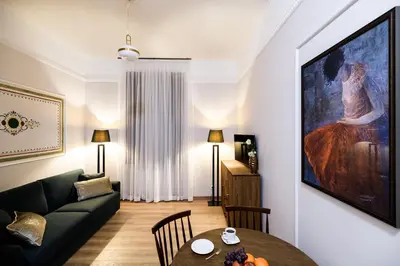 a living room with a couch and a table at Klimatyzowany apartament Dworzec Główny Stare Miasto in Kraków
